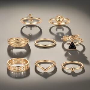 7-Piece Gold Tone Stackable Ring Set Sun Moon Feather and more Size 6.5- 7
